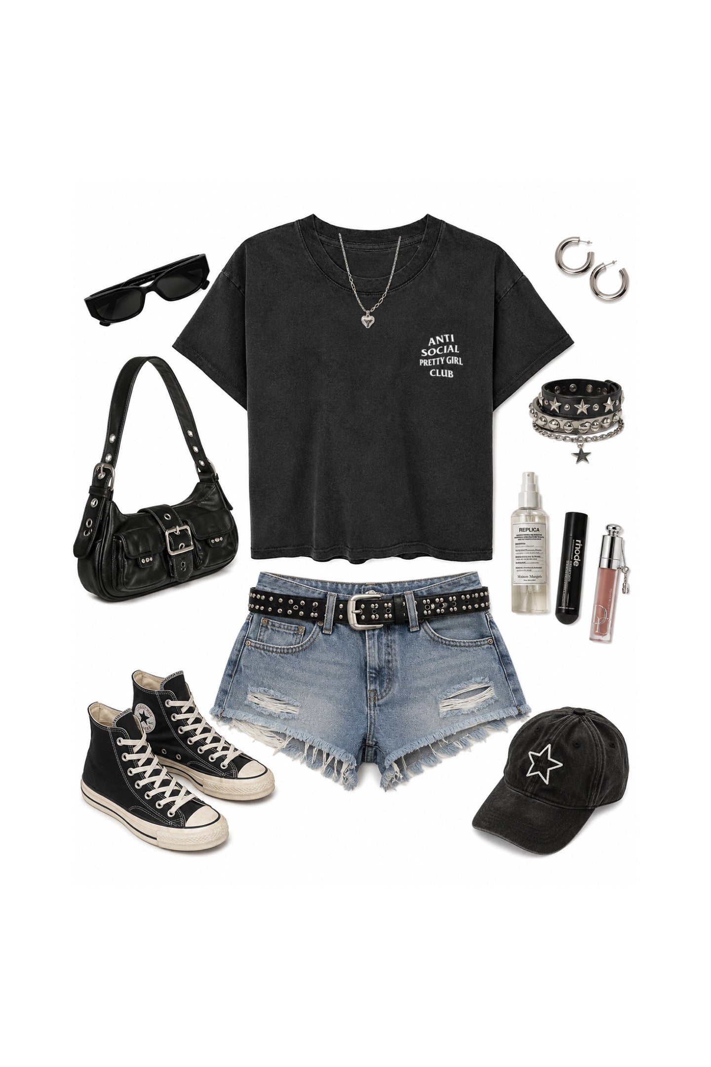 A flat lay outfit arrangement on a white background featuring a black graphic t-shirt, distressed denim shorts, black high-top sneakers, a black studded belt, a black shoulder bag, a black baseball cap, sunglasses, hoop earrings, bracelets, and lip gloss.