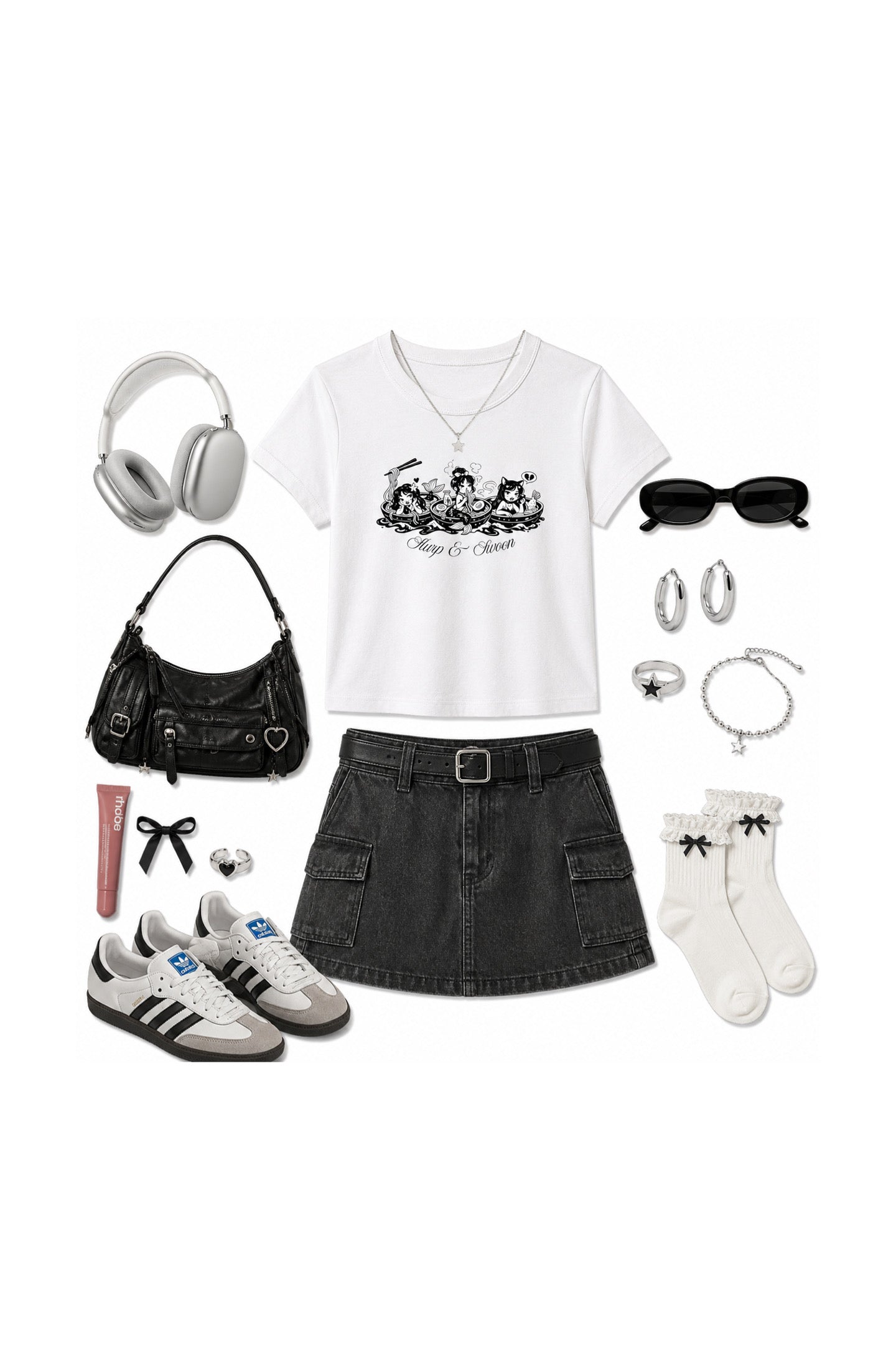 A flat lay outfit arrangement on a white background featuring a white graphic t-shirt, a dark gray denim skirt, white socks, black sunglasses, silver hoop earrings, a black shoulder bag, white sneakers, and silver headphones.
